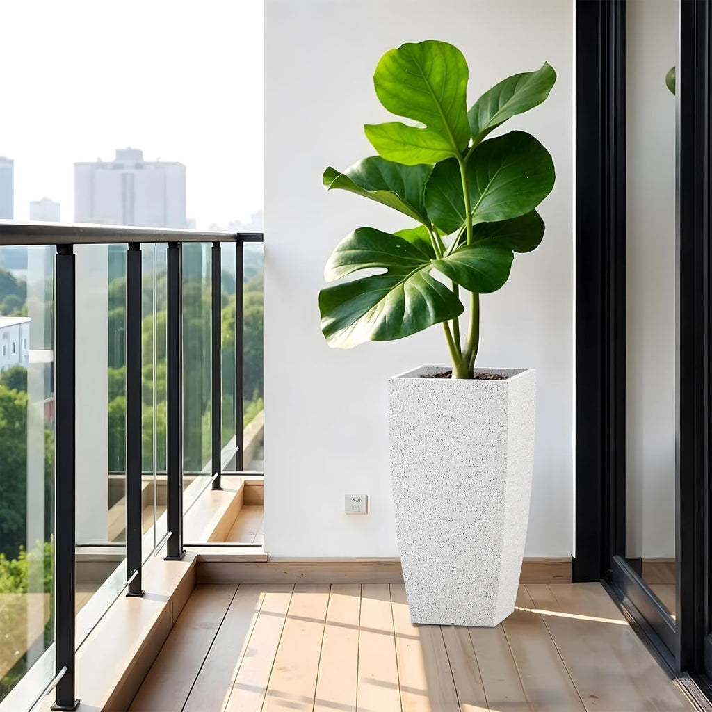 White tall square planter on a balcony